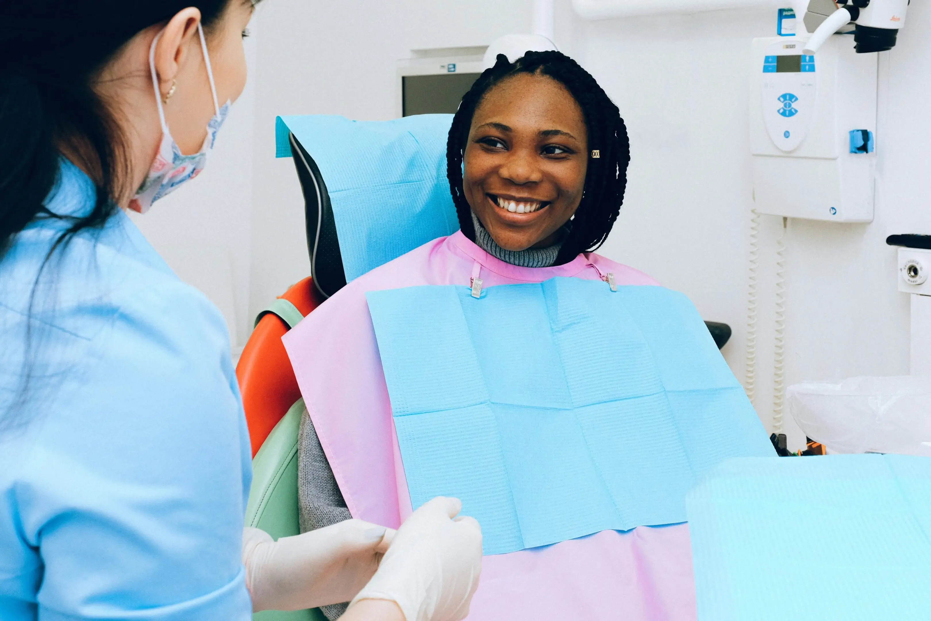 Smiling woman at dentist appointment.